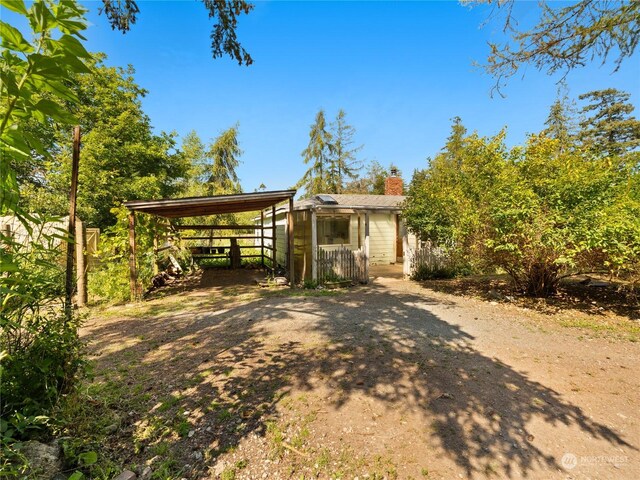 view of property hidden behind natural elements