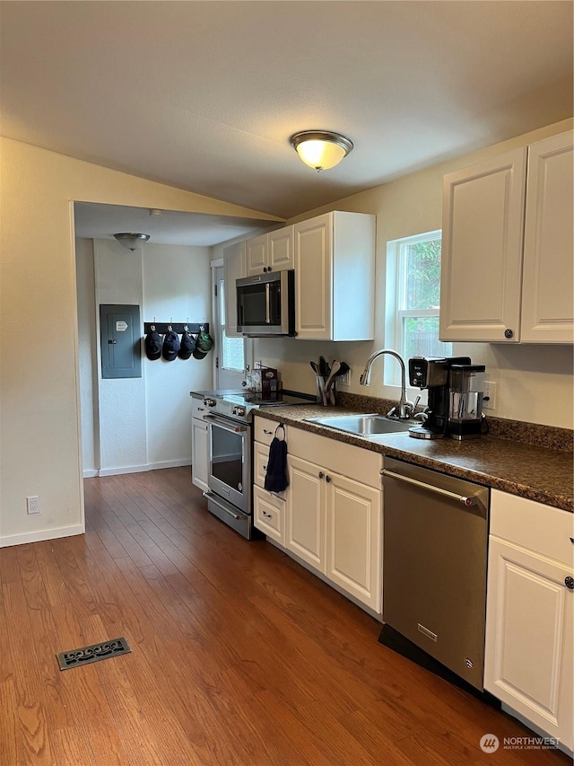 kitchen with sink, stainless steel appliances, dark hardwood / wood-style floors, and white cabinets