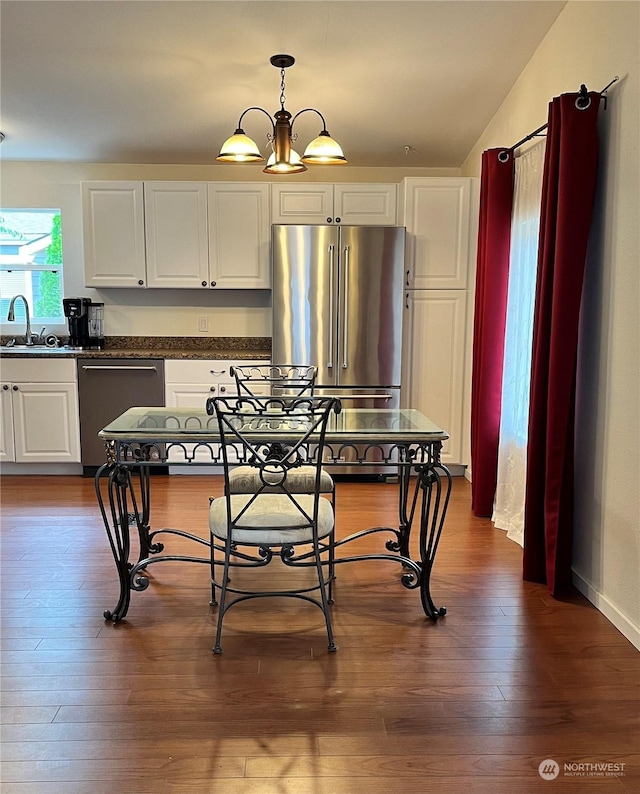 kitchen featuring white cabinetry, stainless steel appliances, dark hardwood / wood-style floors, and sink