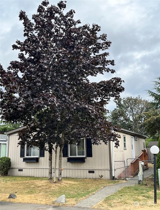 view of home's exterior featuring a lawn