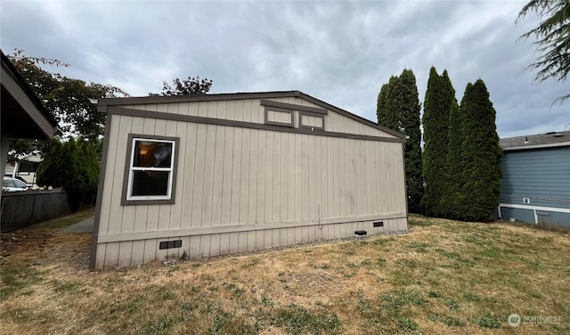 view of home's exterior with a lawn