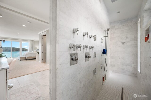 corridor featuring light colored carpet and a water view