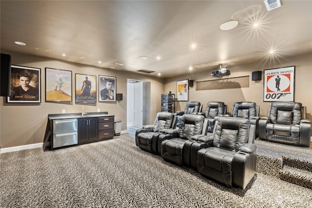 home theater featuring light carpet and bar area