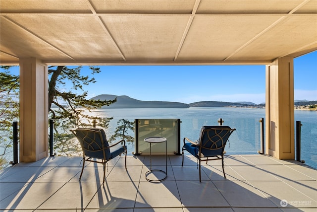 view of patio featuring a water view