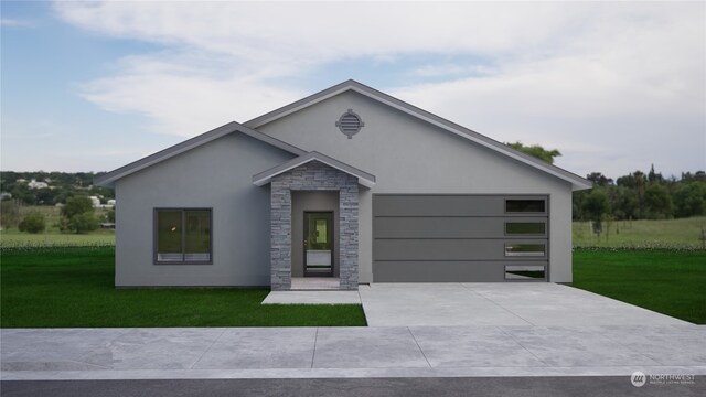 view of front of property featuring a garage and a front yard