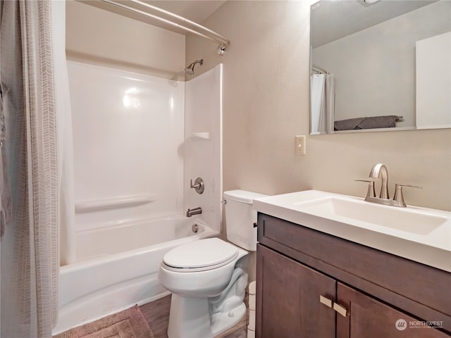 full bathroom with toilet, shower / tub combo with curtain, and vanity