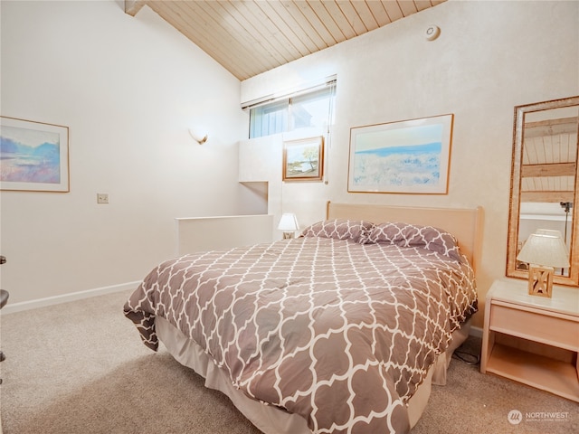 bedroom with carpet floors, vaulted ceiling, and wood ceiling