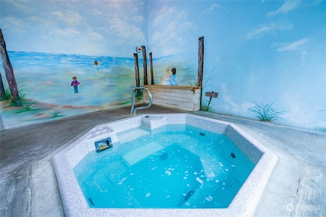 view of pool with a hot tub