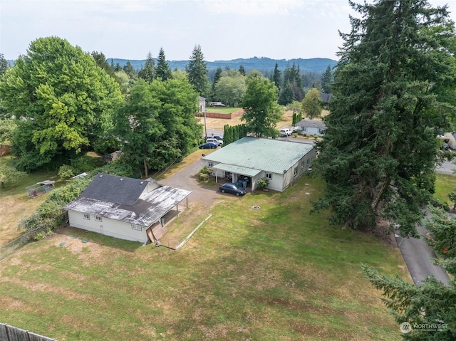 birds eye view of property with a mountain view