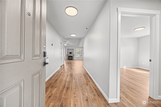 hallway with light wood-type flooring