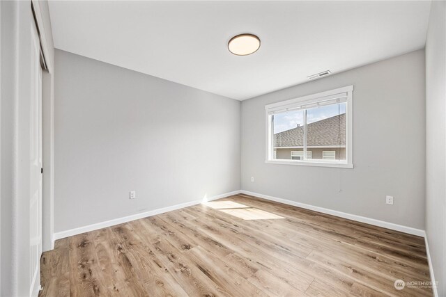 unfurnished room featuring light hardwood / wood-style flooring