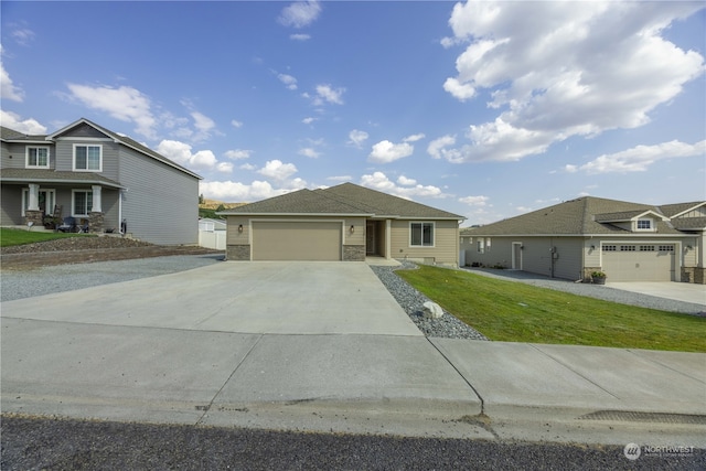 view of front facade with a garage and a front lawn