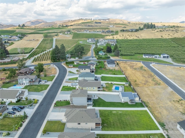 drone / aerial view with a rural view and a mountain view