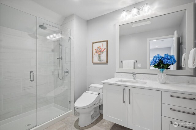 bathroom featuring vanity, toilet, walk in shower, and tile patterned flooring