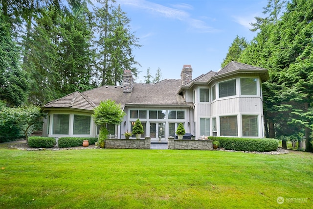 view of front facade featuring french doors and a front yard