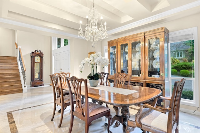 dining room featuring a notable chandelier and ornamental molding