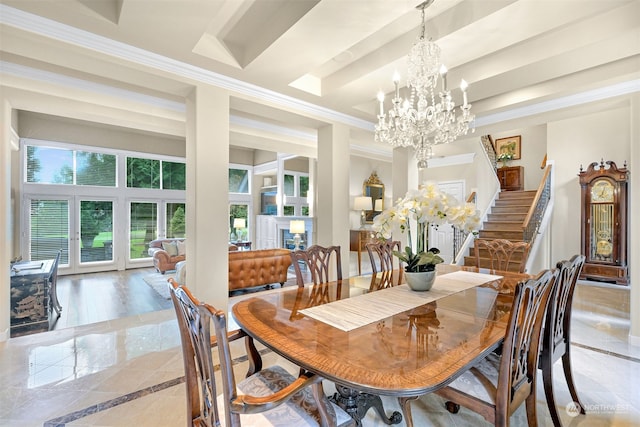 dining area featuring crown molding and an inviting chandelier