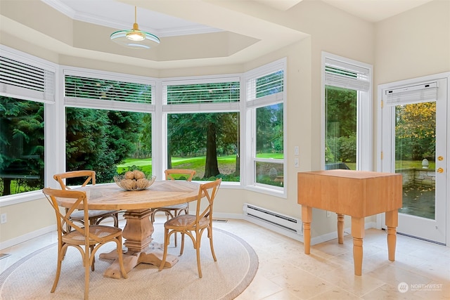 sunroom / solarium with plenty of natural light and a baseboard heating unit