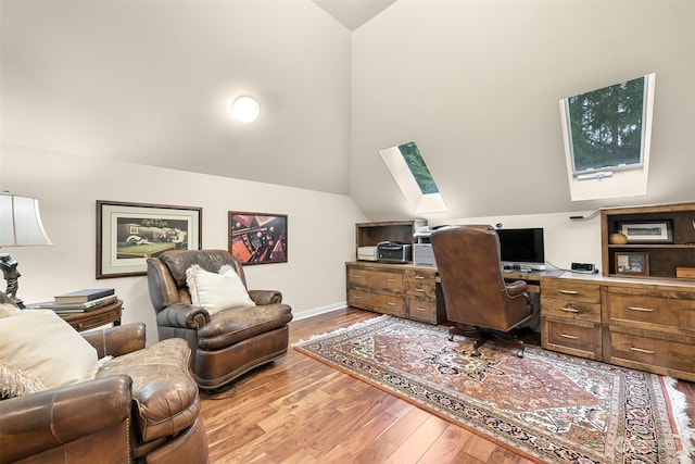 office with vaulted ceiling and hardwood / wood-style flooring