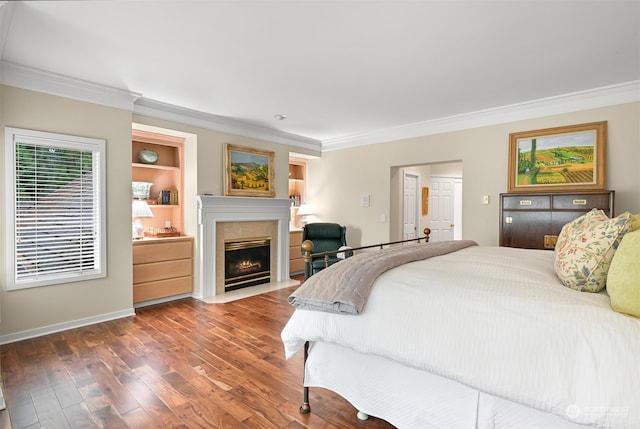 bedroom with dark hardwood / wood-style flooring and crown molding