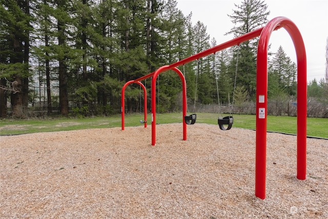 view of playground with a lawn