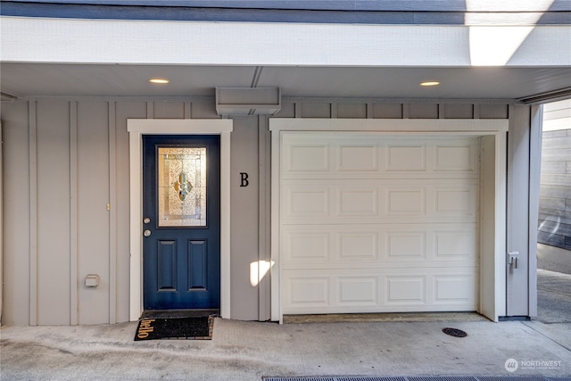 doorway to property featuring a garage