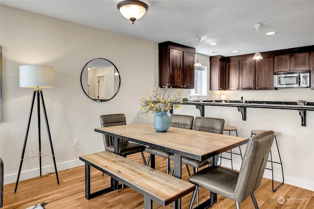 dining area with light hardwood / wood-style flooring