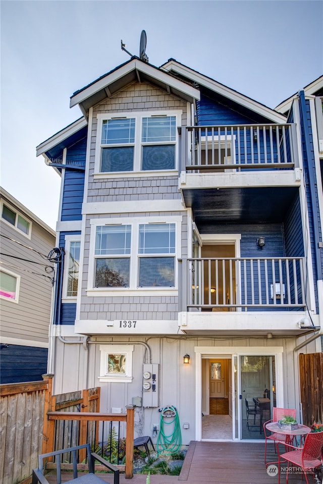 rear view of house with a balcony