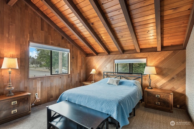 carpeted bedroom featuring wooden walls, multiple windows, and lofted ceiling with beams