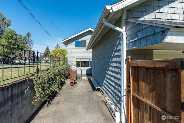 view of property exterior with fence