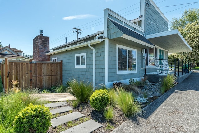 1419 10th St, Anacortes, WA 98221 - view of side of property with covered porch and fence