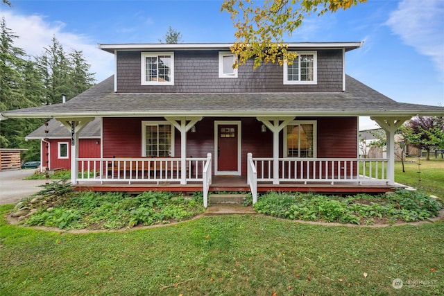 farmhouse with a front lawn and a porch