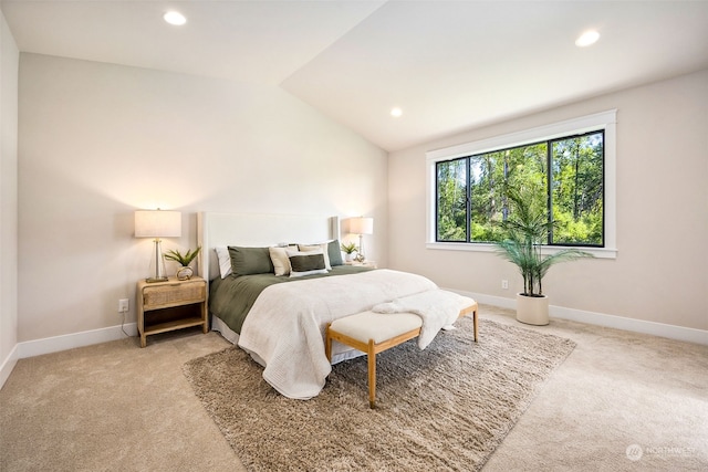 carpeted bedroom featuring lofted ceiling