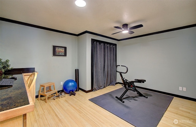 24424 Sandridge Rd, Ocean Park, WA 98640 - exercise room featuring ceiling fan, ornamental molding, wood finished floors, and baseboards