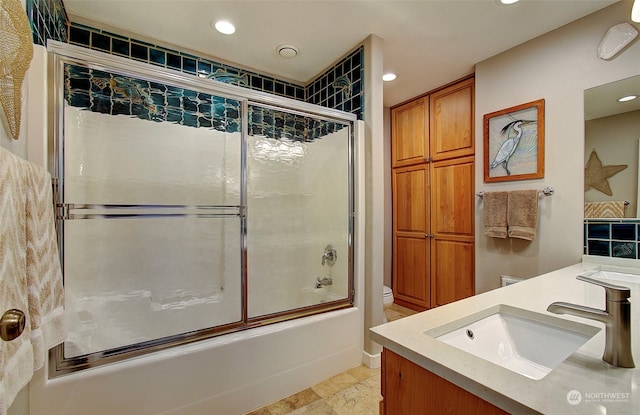 24424 Sandridge Rd, Ocean Park, WA 98640 - bathroom featuring vanity, bath / shower combo with glass door, recessed lighting, and toilet