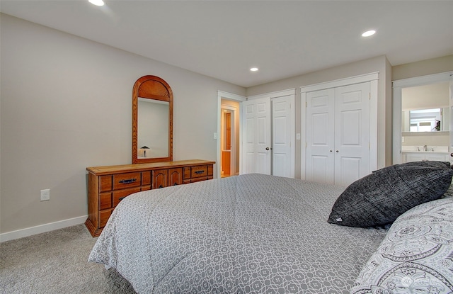 24424 Sandridge Rd, Ocean Park, WA 98640 - bedroom featuring baseboards, recessed lighting, light colored carpet, and two closets
