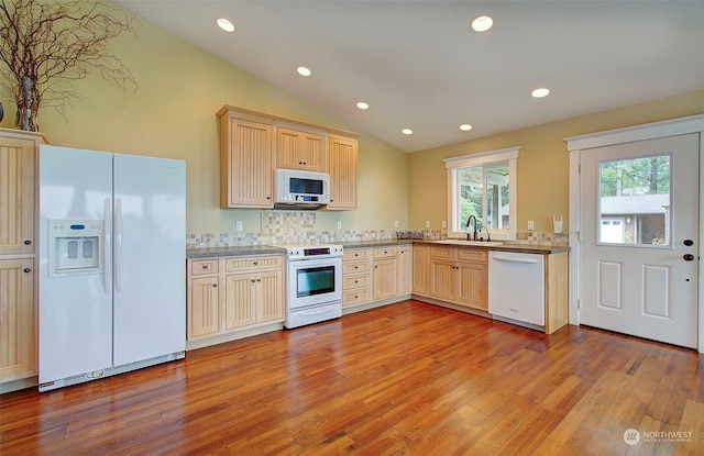 24424 Sandridge Rd, Ocean Park, WA 98640 - kitchen with white appliances, light wood finished floors, a sink, recessed lighting, and lofted ceiling
