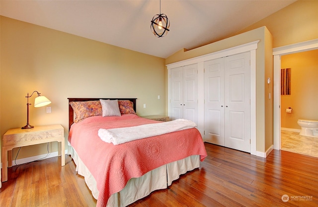 24424 Sandridge Rd, Ocean Park, WA 98640 - bedroom with vaulted ceiling, wood finished floors, a closet, and baseboards