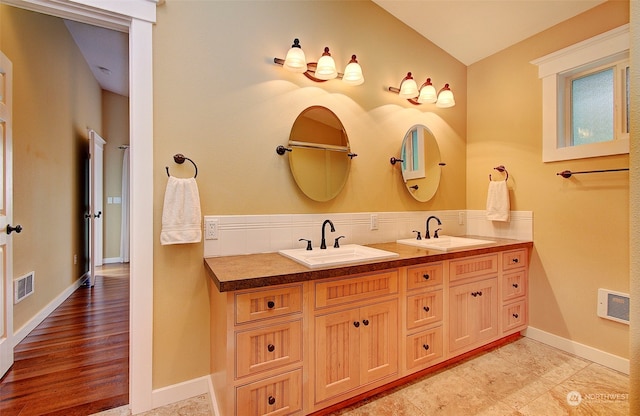 24424 Sandridge Rd, Ocean Park, WA 98640 - full bath featuring double vanity, baseboards, and vaulted ceiling