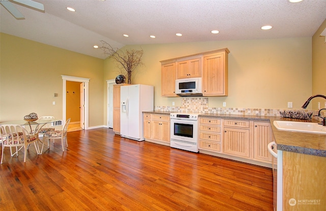 24424 Sandridge Rd, Ocean Park, WA 98640 - kitchen featuring white appliances, a sink, wood finished floors, recessed lighting, and light brown cabinetry
