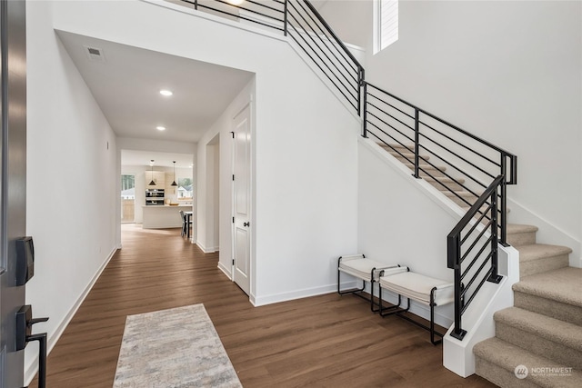 staircase featuring wood-type flooring