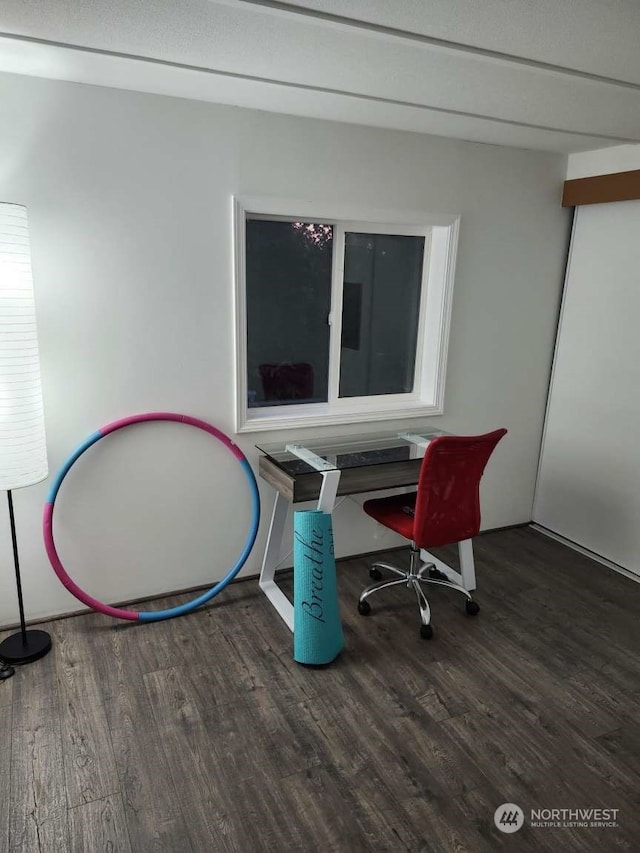 home office with dark wood-type flooring