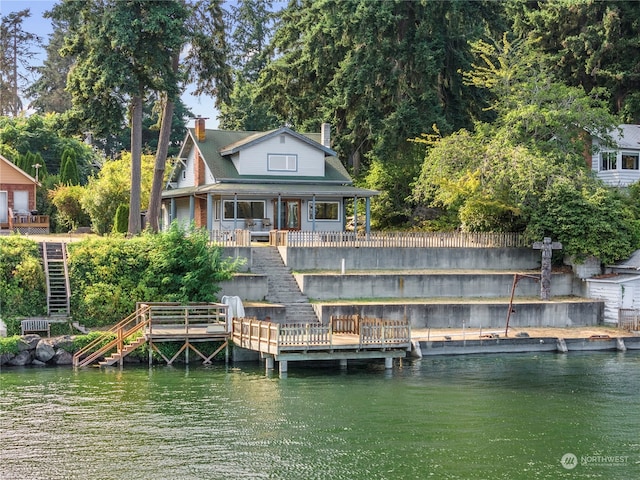 dock area with a deck with water view