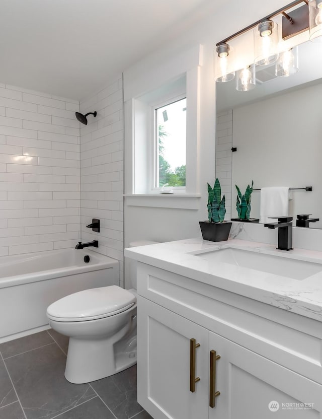 bathroom with toilet, bathtub / shower combination, and vanity