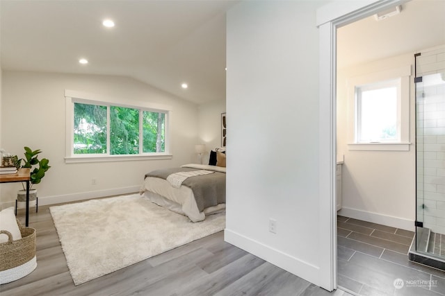 bedroom featuring recessed lighting, vaulted ceiling, baseboards, and wood finished floors