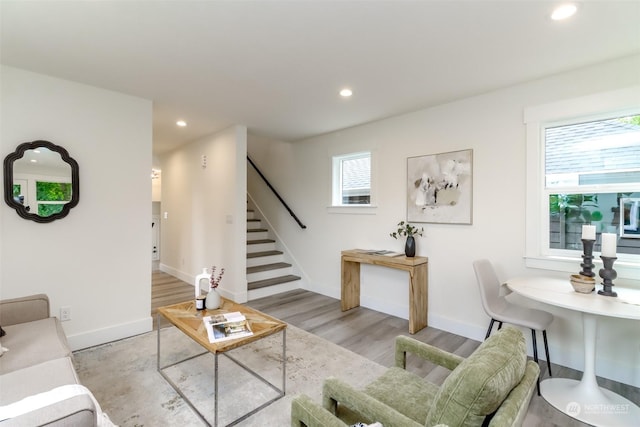 living room featuring plenty of natural light, stairway, and recessed lighting