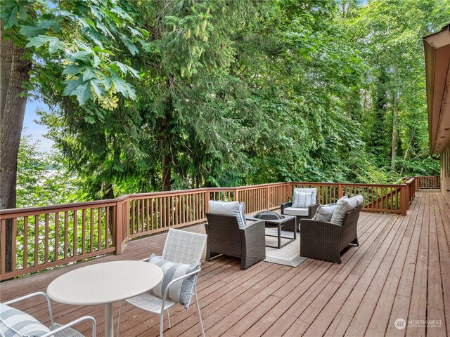 deck with an outdoor hangout area