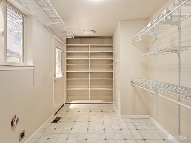 walk in closet featuring light tile patterned floors