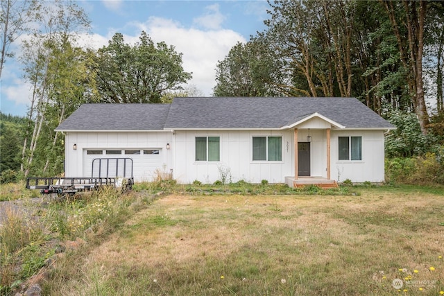 3021 Stella Rd, Longview, WA 98632 - ranch-style house with a front lawn, a garage, board and batten siding, and roof with shingles