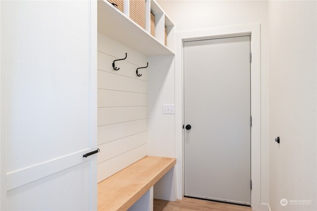 mudroom with light hardwood / wood-style flooring